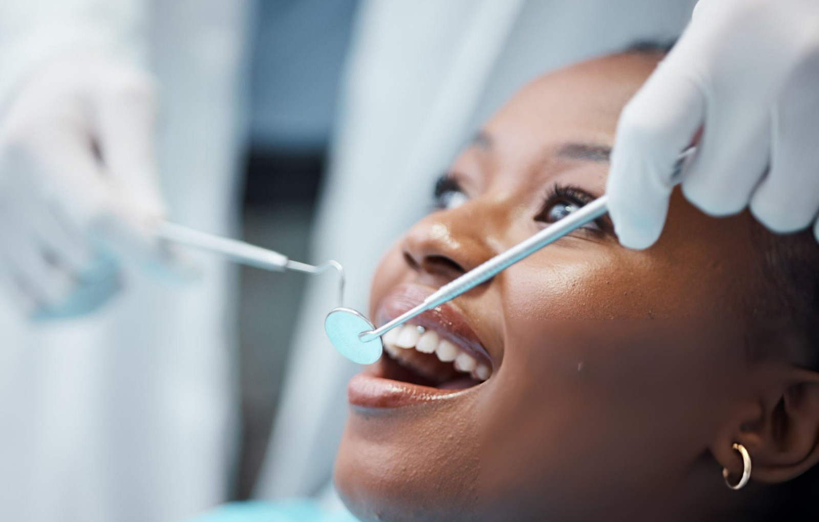 A patient smiling during a dental examination